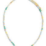 Multicolored beaded necklace in blues, yellows, clears and corals on white background