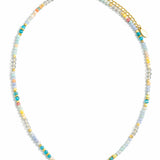 Multicolored beaded necklace in blues, yellows, clears and corals on white background