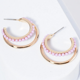 Set of double Gold hoops, one of the hoops is lined with light purple beads.