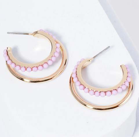 Set of double Gold hoops, one of the hoops is lined with light purple beads.