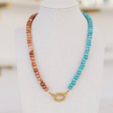 Clay and turquoise colored beaded necklace with a gold clasp.