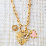 Picture of gold toggle chain with a pink heart charm, a textured gold charm with diamond heart and a large gold heart pendant with a diamond in the center.