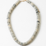 Necklace with white and gray beads on a white background