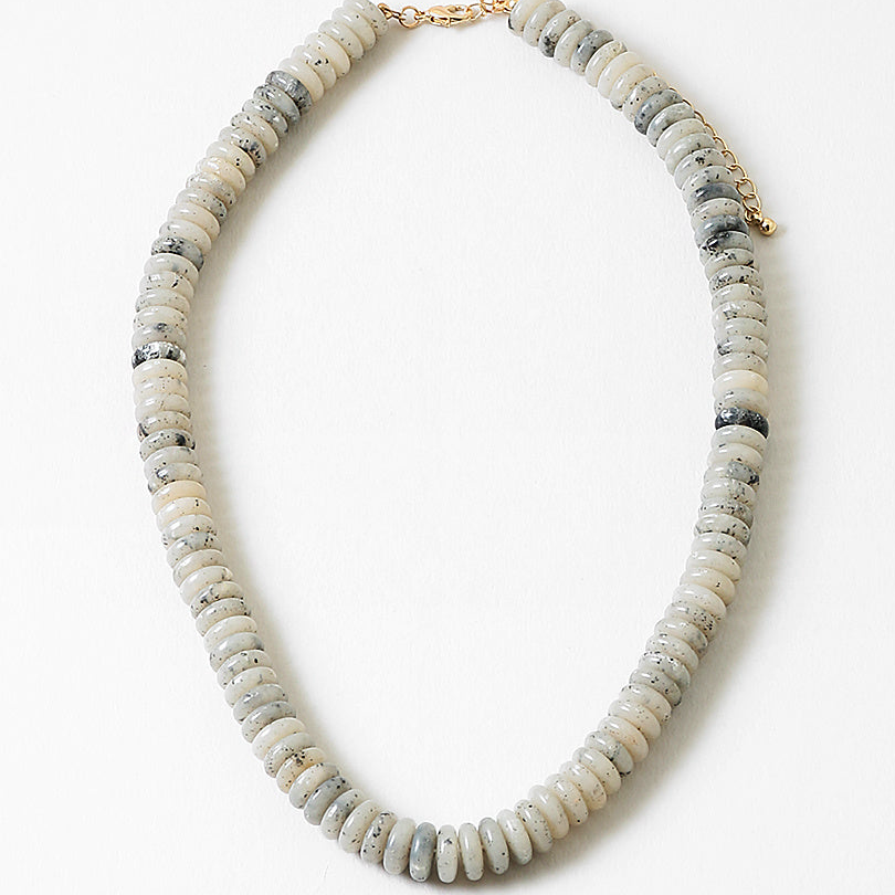Necklace with white and gray beads on a white background
