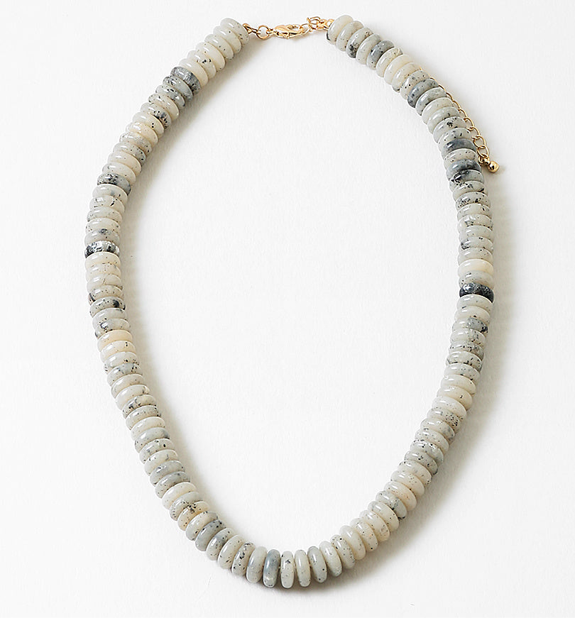 Necklace with white and gray beads on a white background
