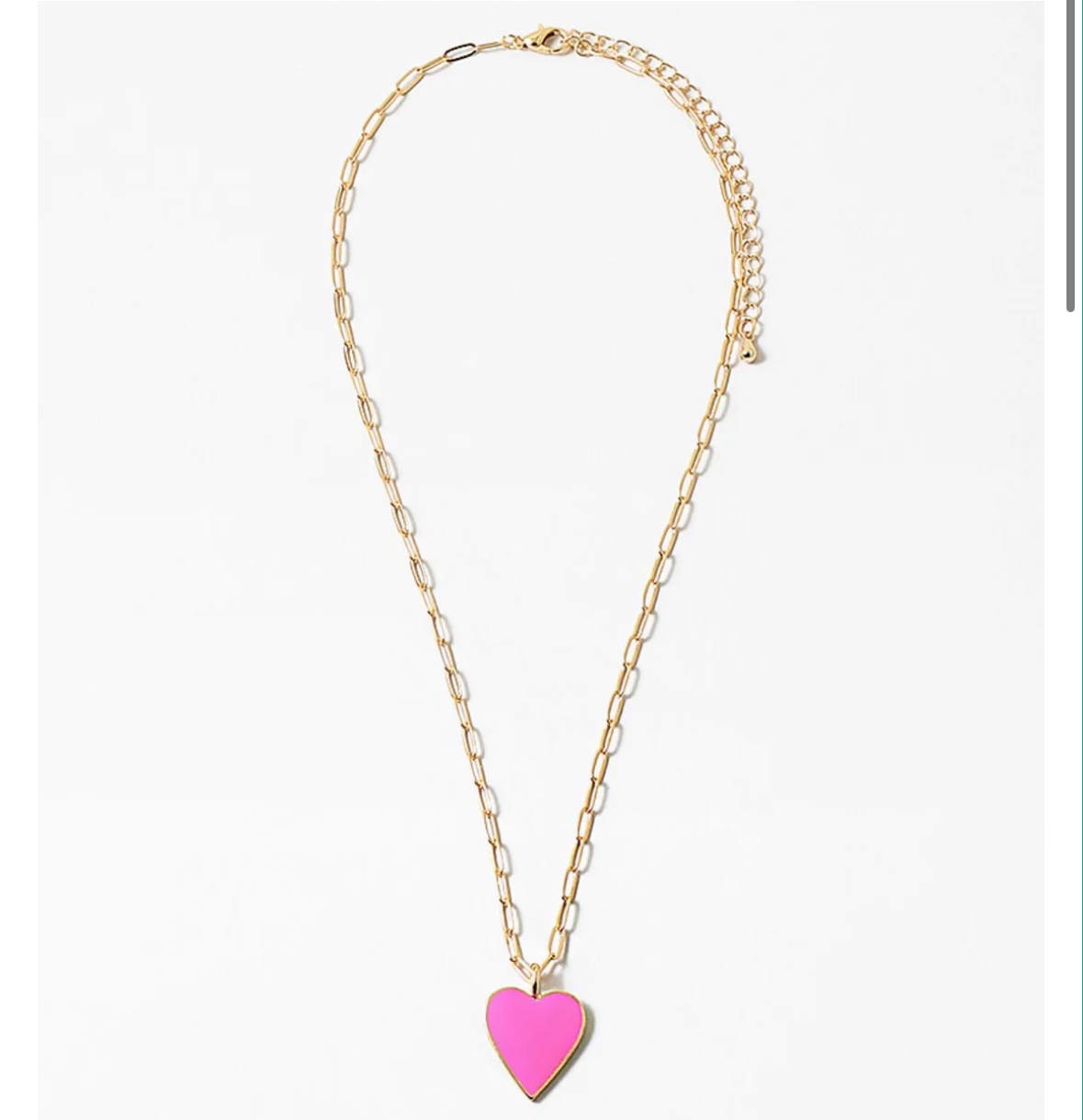 Gold chain link necklace with a pink heart pendant on a white background