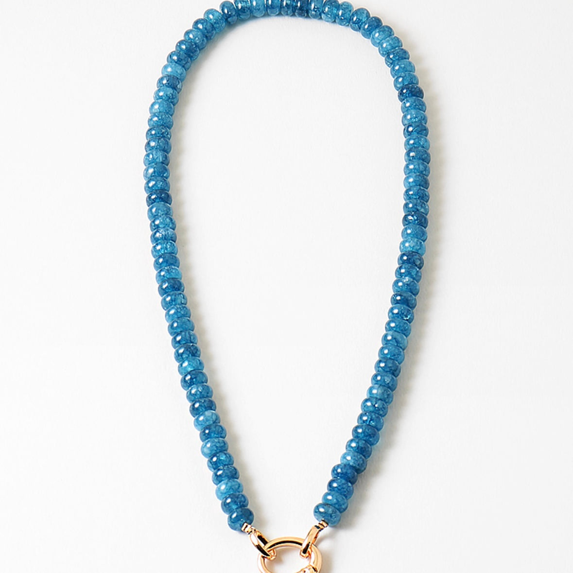 Blue beaded necklace with a gold clasp on a white background