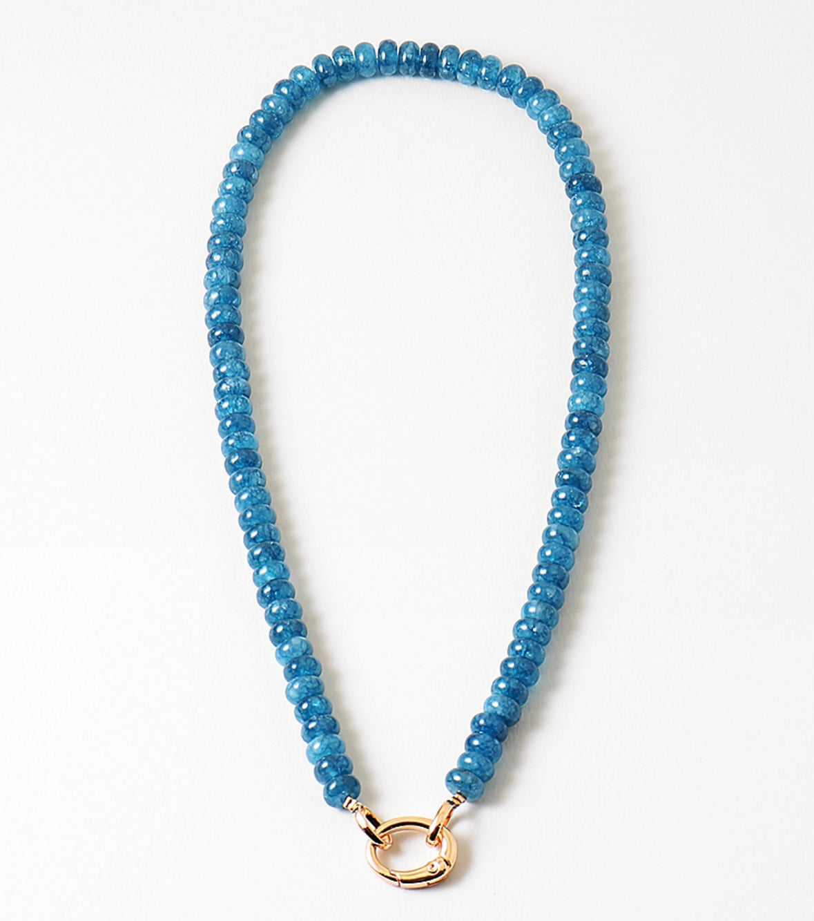 Blue beaded necklace with a gold clasp on a white background