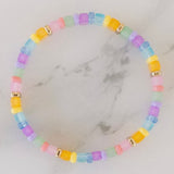 Picture of a brightly colored bracelet with light blue, light pink and yellow beads.