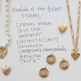 Picture of a fresh water pearl necklace and chain toggle necklace with several different gold heart and disc pendants.  Text reads, "Meaning of the Heart Symbol: Central wisdom, self love, movement, sincerity & clarity, friendship, compassion & understanding, affection, truth."