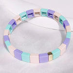 Square bead bracelet in blue, purple and cream.