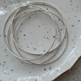 Five Silver Bangles