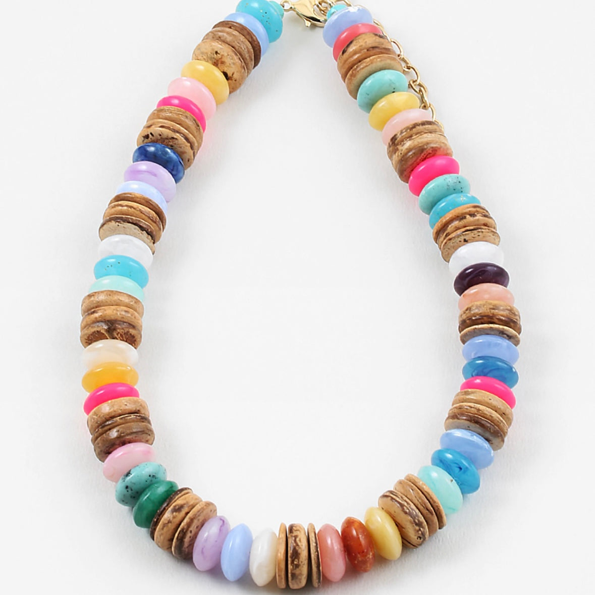 A chunky multicolor bead necklace with coconut disc spacer beads.