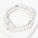 Set of three marble bead strands.