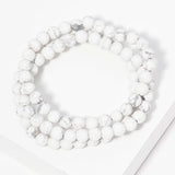 Set of three marble bead strands.