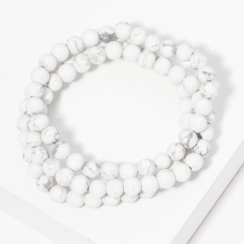 Set of three marble bead strands.