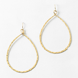 Gold tear drop dangle hoop earrings on a white background