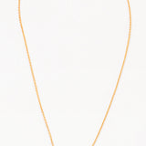 A gold-colored necklace with two interlocking circles as the central pendant on a white background.