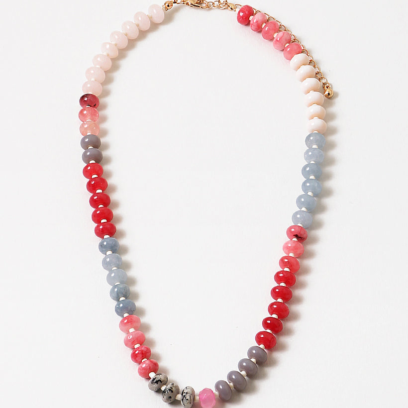 An image of a multicolored beaded short necklace (blue, gray, and red)