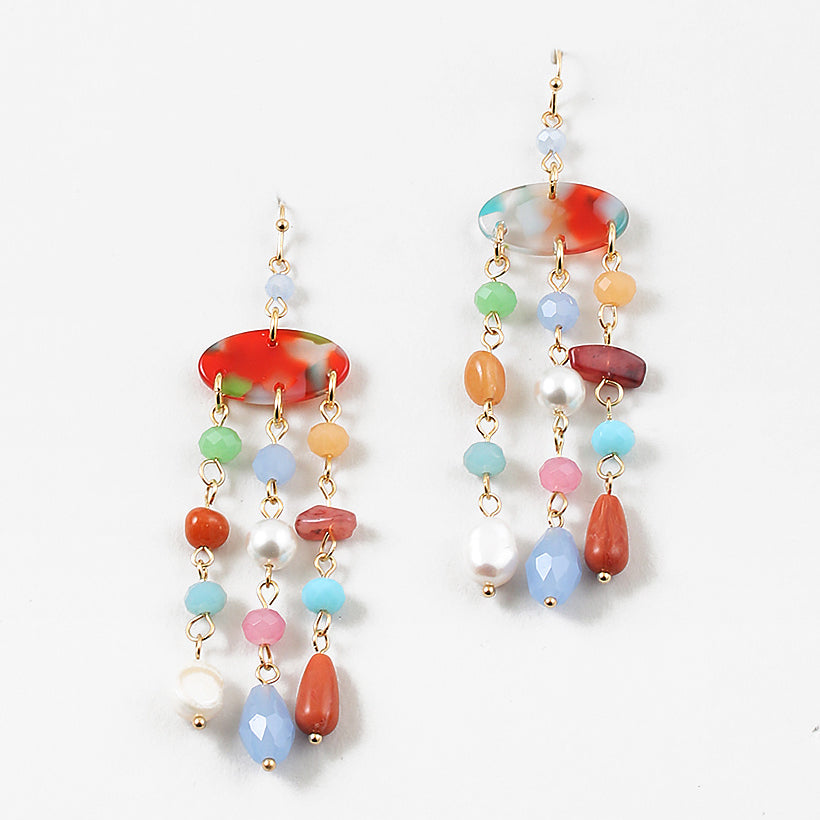 Set of dangle earrings with three strands of small beads hanging from each oval base. Earrings are shades of red, blues, greens and fresh water pearls.