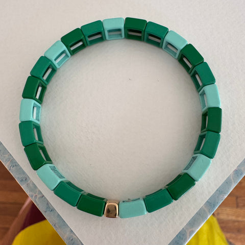 Square bead bracelet in shades of ombre green.
