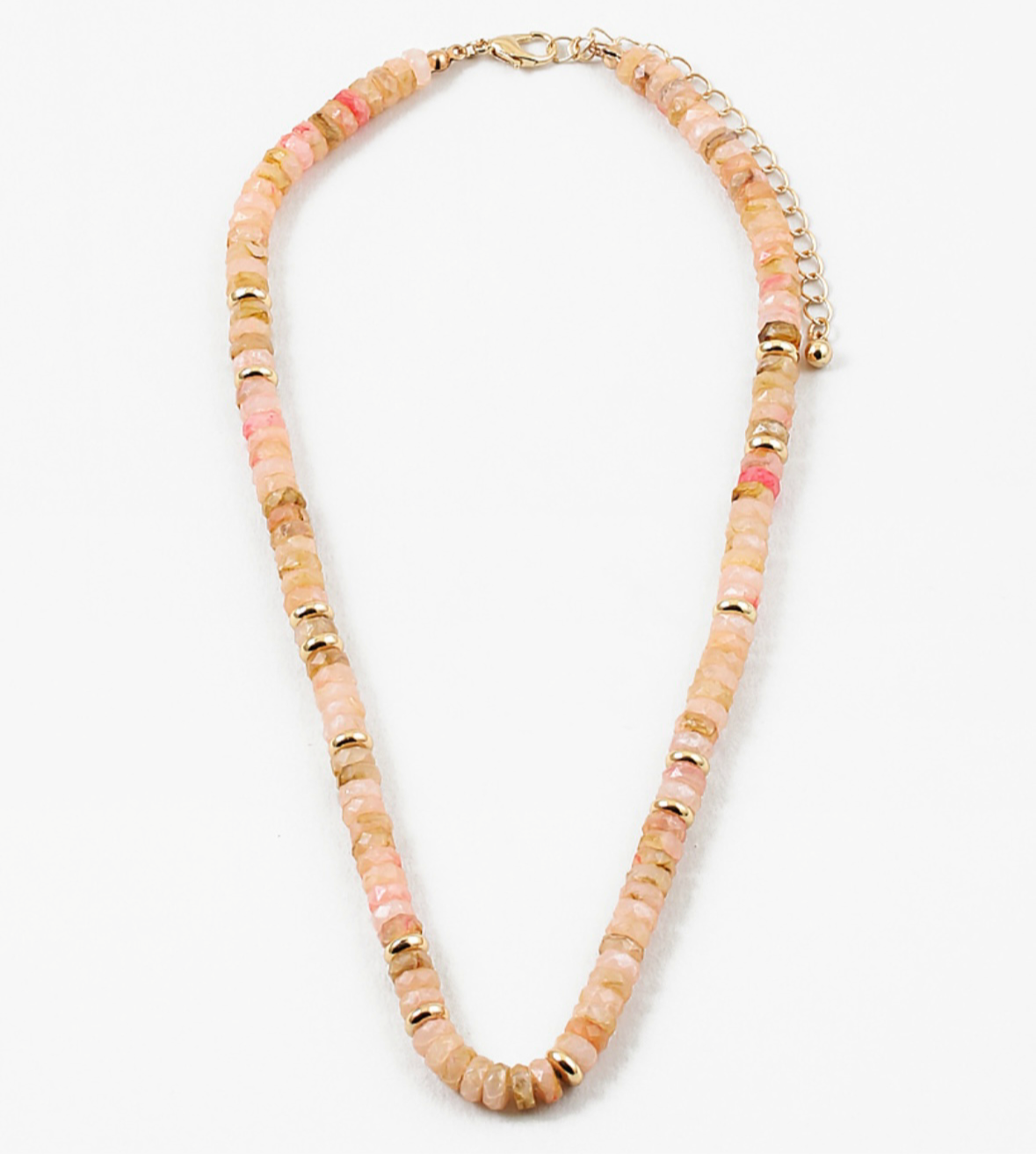 Picture of peach colored bead necklace with gold spacers beads interspersed through out.