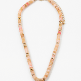 Picture of peach colored bead necklace with gold spacers beads interspersed through out.