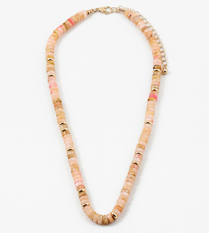 Picture of peach colored bead necklace with gold spacers beads interspersed through out.