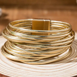 Picture of a gold wrap bracelet made of 20 gold bands.