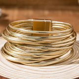 Picture of a gold wrap bracelet made of 20 gold bands.