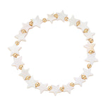 A stretch bracelet composed of gold beads and mother-of-pearl stars.
