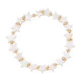 A stretch bracelet composed of gold beads and mother-of-pearl stars.