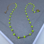 Simple chain with bright yellow beads.