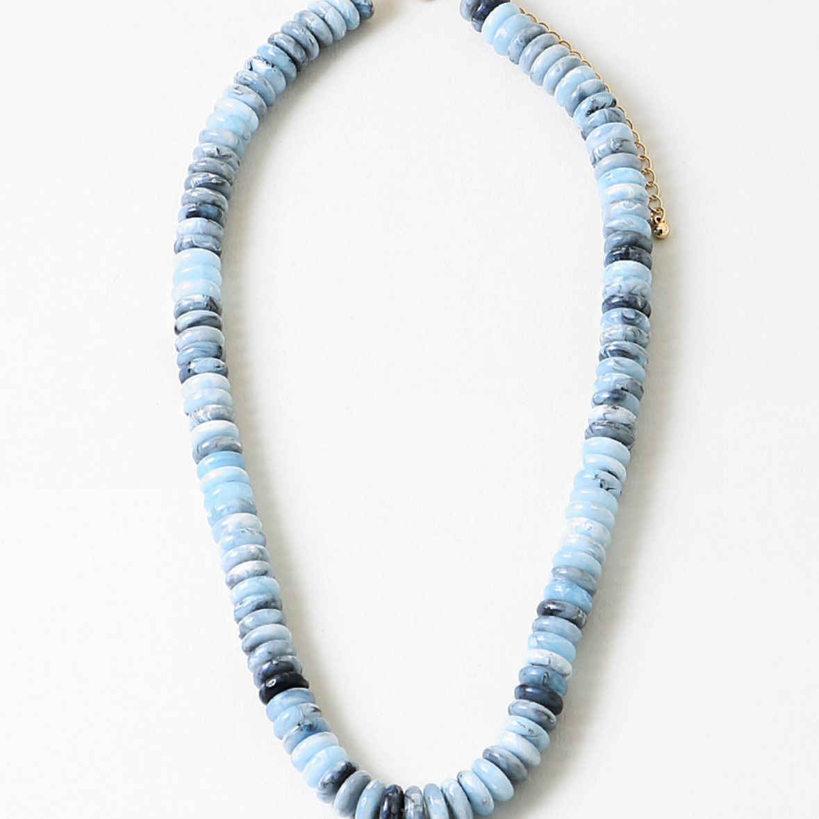 Necklace with blue and gray beads on a white background