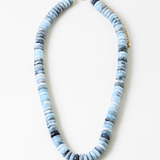 Necklace with blue and gray beads on a white background