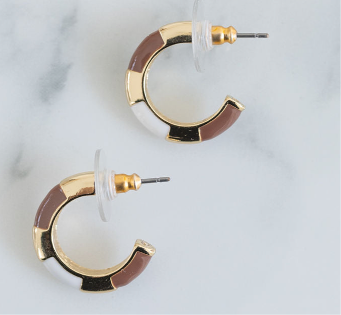 Small gold hoops with white and light brown resin accent sections.