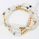 Set of semi precious white, grey and teal bead bracelets with gold accent beads.