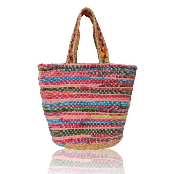 Brightly colored woven jute bag many colors and wide geometric patterned shoulder straps.