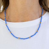 Blue beaded necklace with gold spacer beads