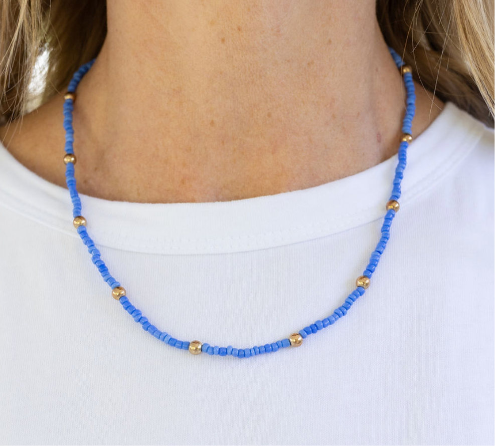 Blue beaded necklace with gold spacer beads