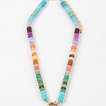 Picture of a bead necklace in blues, purples, oranges and greens with a gold toggle clasp.
