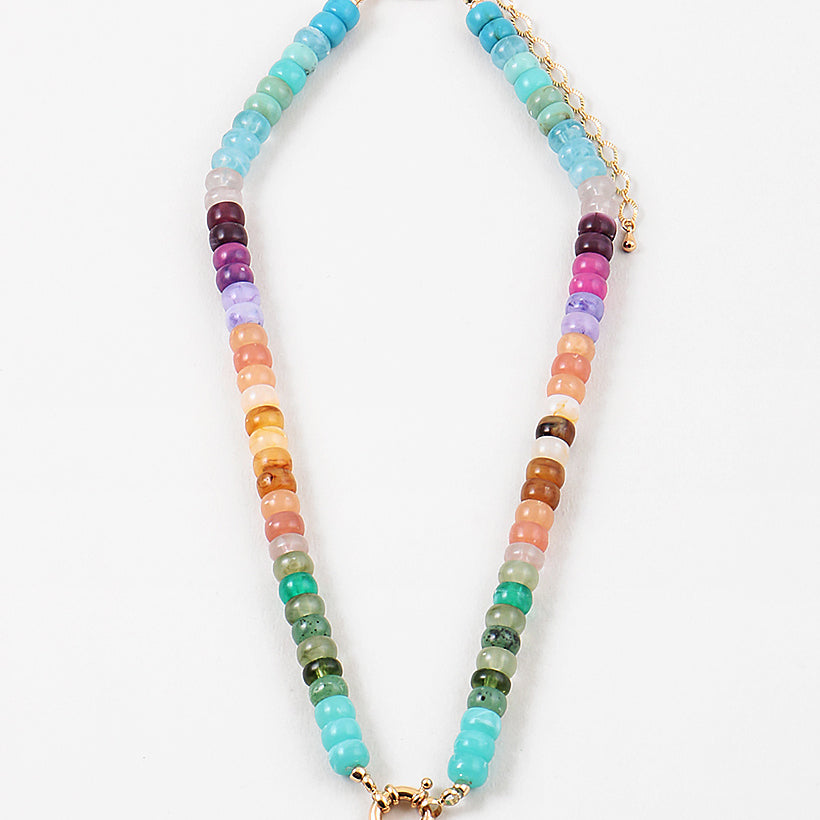 Picture of a bead necklace in blues, purples, oranges and greens with a gold toggle clasp.