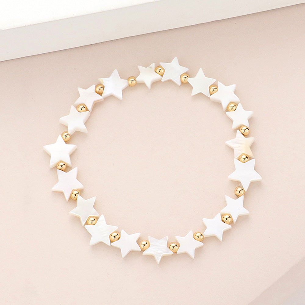 Stretch bracelet made out of star beads with gold spacers beads.