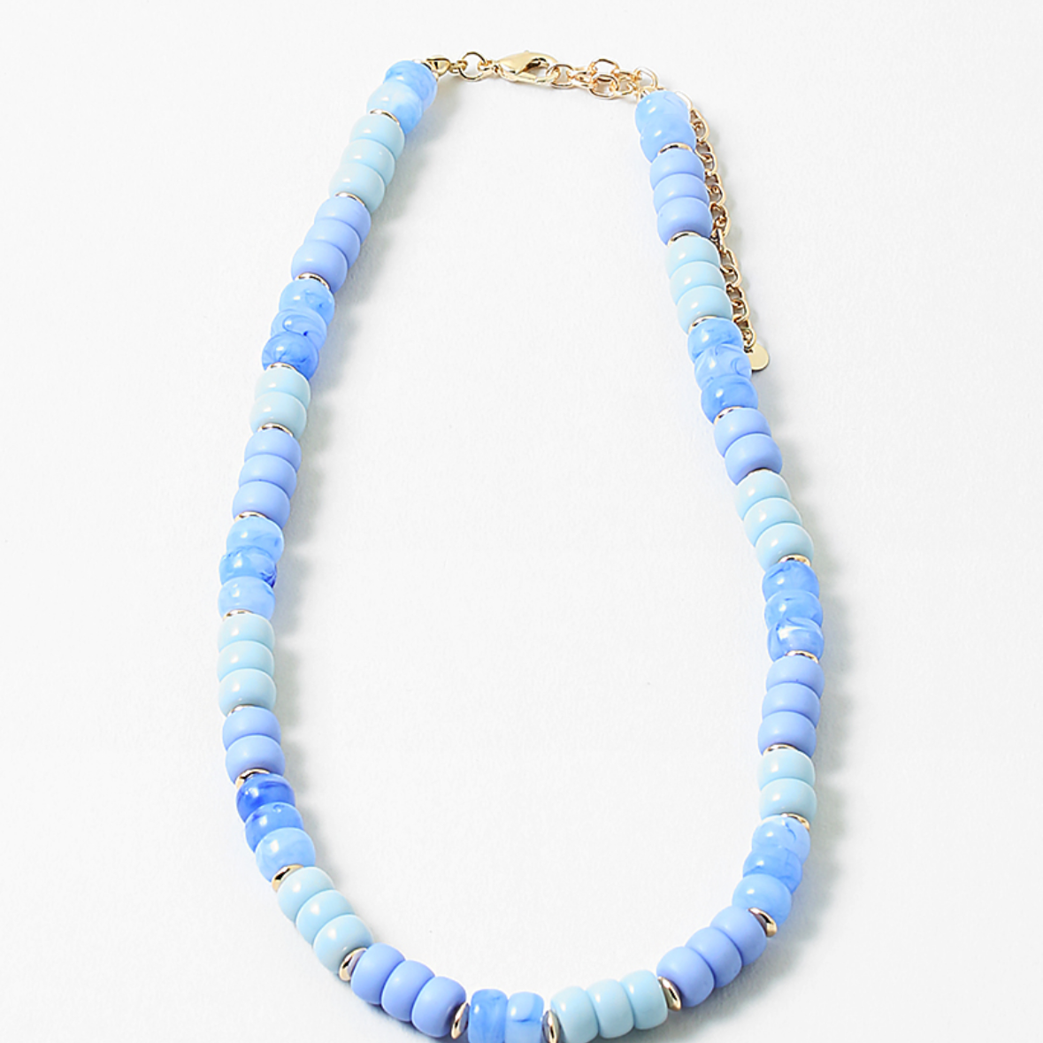 An image of a blue beaded short necklace/choker with little gold beads