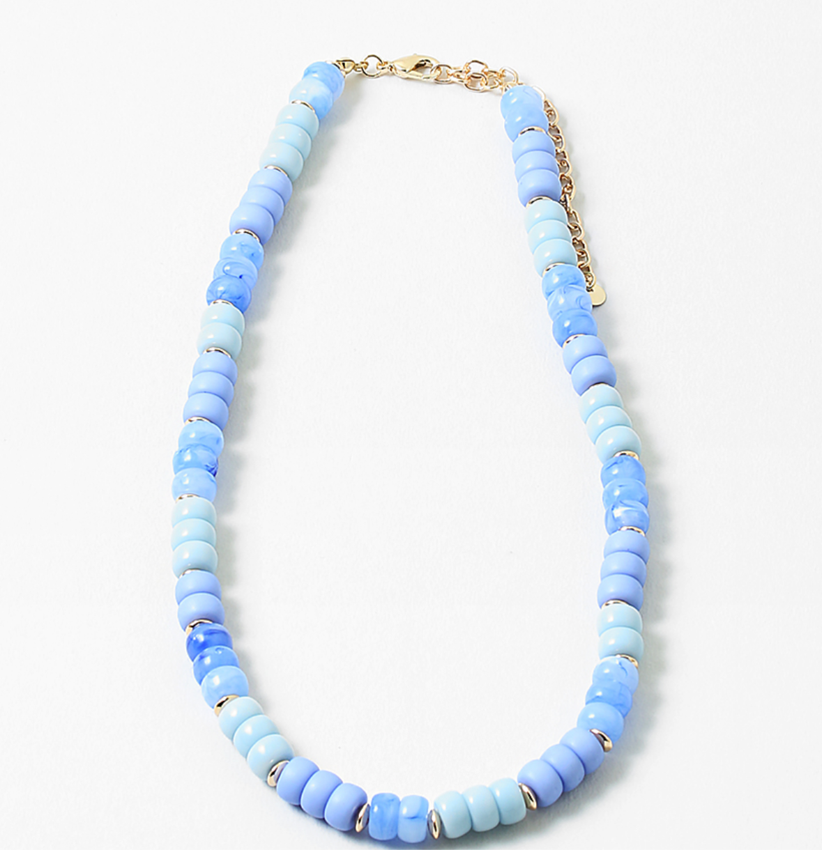 An image of a blue beaded short necklace/choker with little gold beads