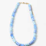 An image of a blue beaded short necklace/choker with little gold beads