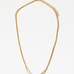 Dainty gold necklace with a petite knot in the center