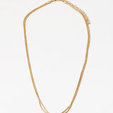 Dainty gold necklace with a petite knot in the center