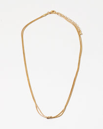 Dainty gold necklace with a petite knot in the center