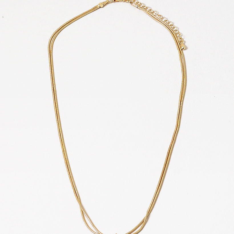 Dainty gold necklace with a petite knot in the center